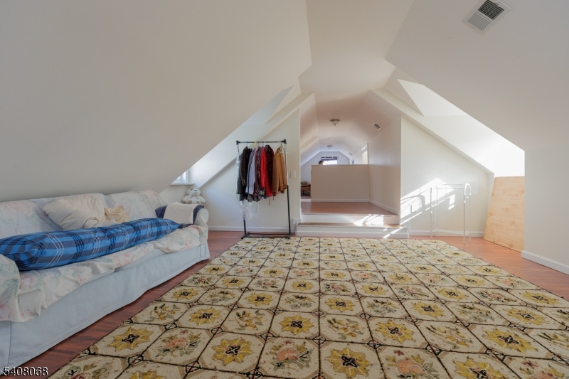 348 Cherry Street Elizabeth, NJ 07208 - Photo 14 of 28 a bedroom with a bed and a lamp on the dresser
