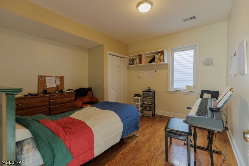 348 Cherry Street Elizabeth, NJ 07208 - Photo 16 of 28 a bedroom with a bed and furniture