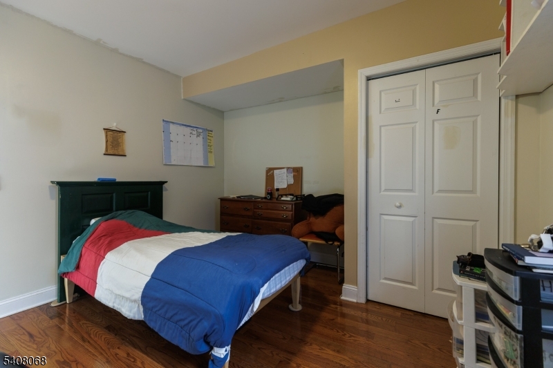 348 Cherry Street Elizabeth, NJ 07208 - Photo 17 of 28 a bedroom with a bed and a dresser