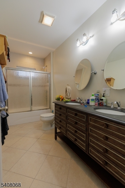 348 Cherry Street Elizabeth, NJ 07208 - Photo 22 of 28 a bathroom with a double vanity sink and a mirror
