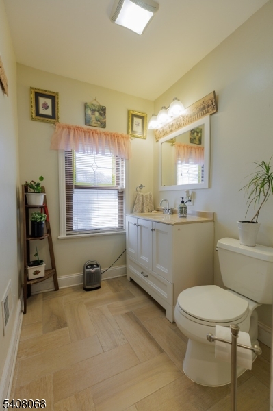 348 Cherry Street Elizabeth, NJ 07208 - Photo 23 of 28 a bathroom with a toilet sink and mirror