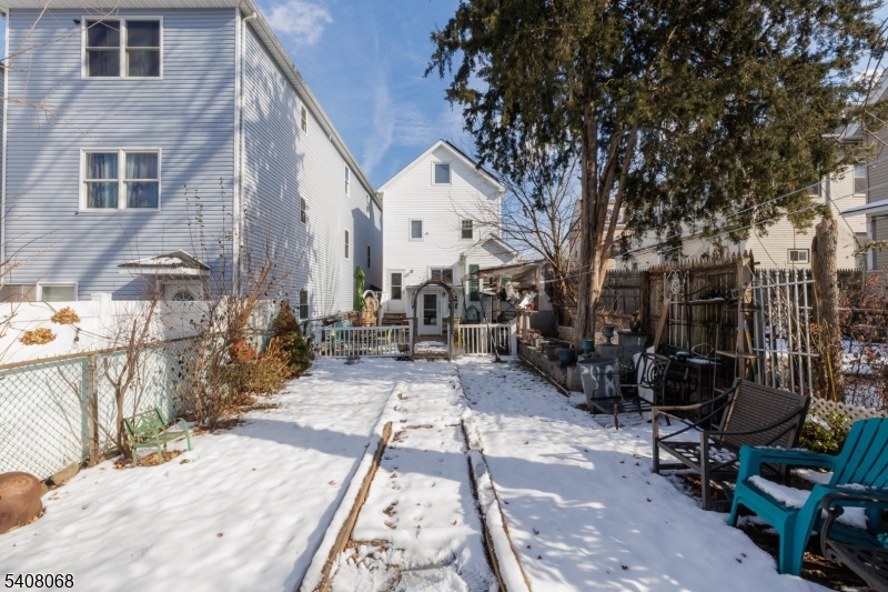 348 Cherry Street Elizabeth, NJ 07208 - Photo 28 of 28 a view of backyard with wheel chair potted plants and large tree