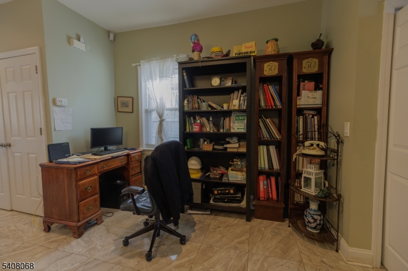 348 Cherry Street Elizabeth, NJ 07208 - Photo 4 of 28 a view of a workspace with bookshelf