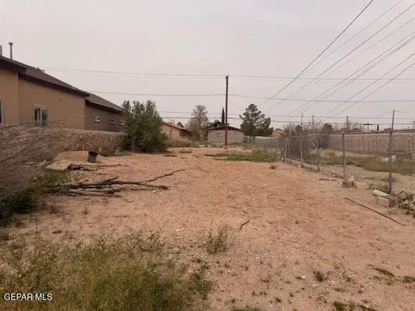 a view of a dry yard covered with snow