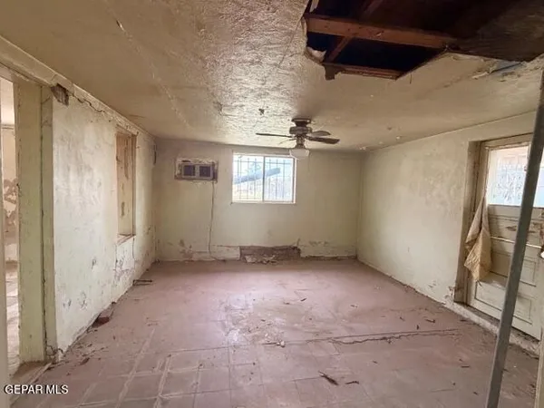 a view of an empty room with a window
