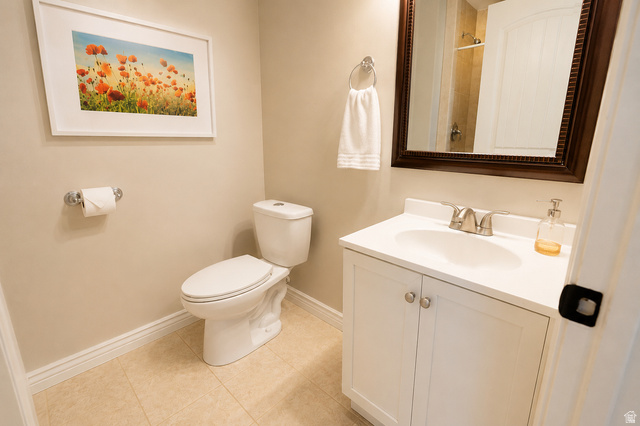 896 Cres Drive South Mapleton, UT 84664 - Photo 28 of 32 Bathroom featuring a white vanity with integrated sink, chrome faucet, and a wall-mounted mirror