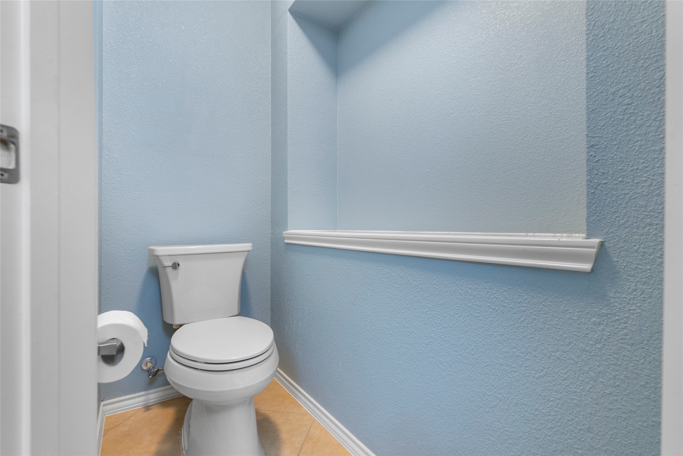 5239 Schuler Street, Unit C Houston, TX 77007 - Photo 12 of 16 a white toilet sitting next to a white wall