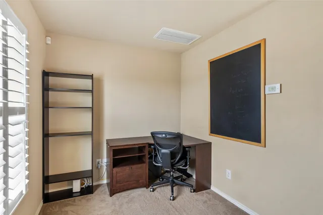 a workspace with furniture and a window