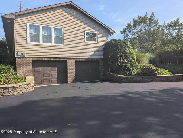 an aerial view of a house with a garden