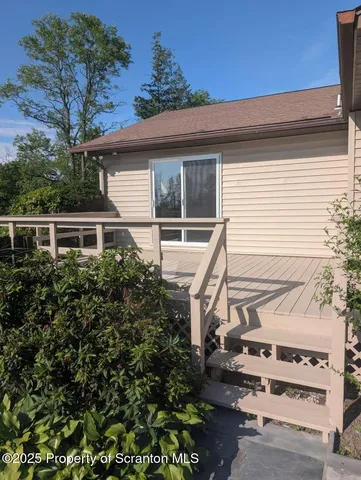 a large kitchen with a sink and refrigerator