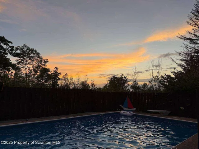 a kitchen with a sink and refrigerator