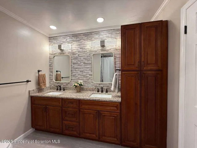 a bathroom with a bathtub and a sink