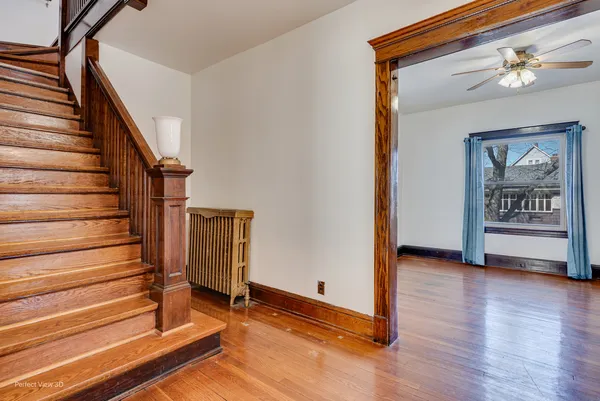 a view of an entryway with wooden floor