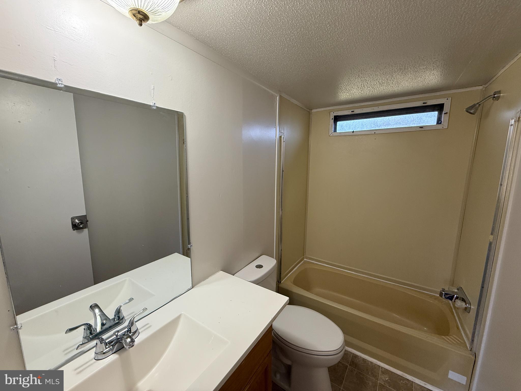 3611 Shirleys Hill Road Partlow, VA 22534 - Photo 9 of 25 a bathroom with a granite countertop sink toilet and shower