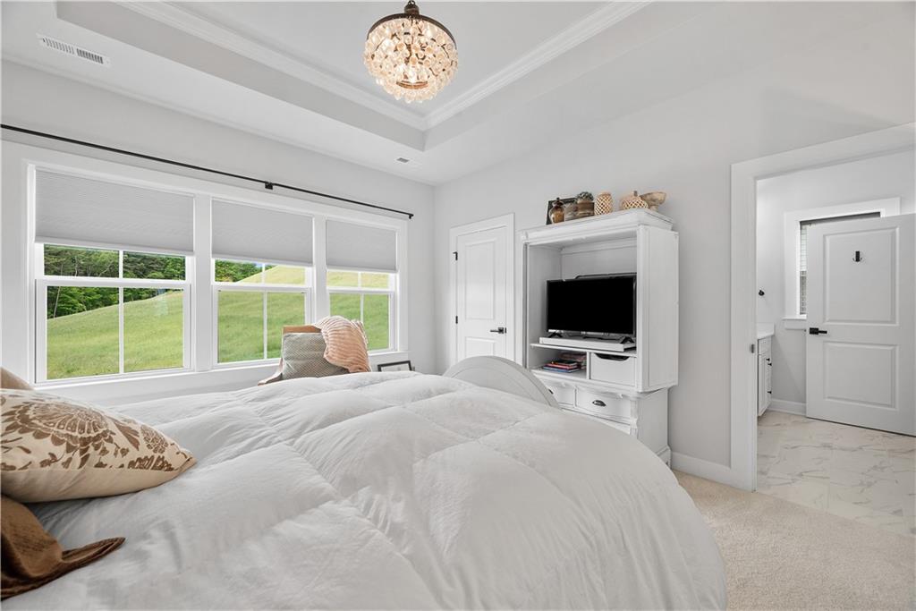 606 Spruce Lane Canonsburg, PA 15317 - Photo 17 of 36 a bedroom with a bed and a flat screen tv