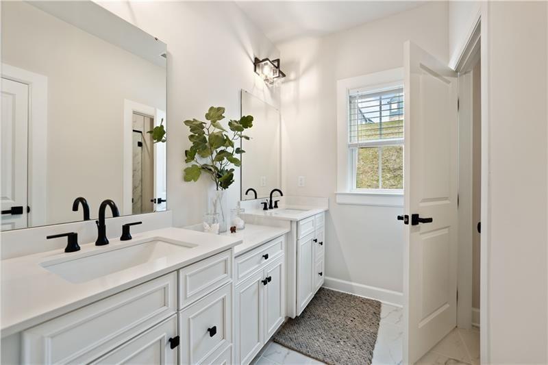 606 Spruce Lane Canonsburg, PA 15317 - Photo 19 of 36 a bathroom with a double vanity sink a mirror and a shower