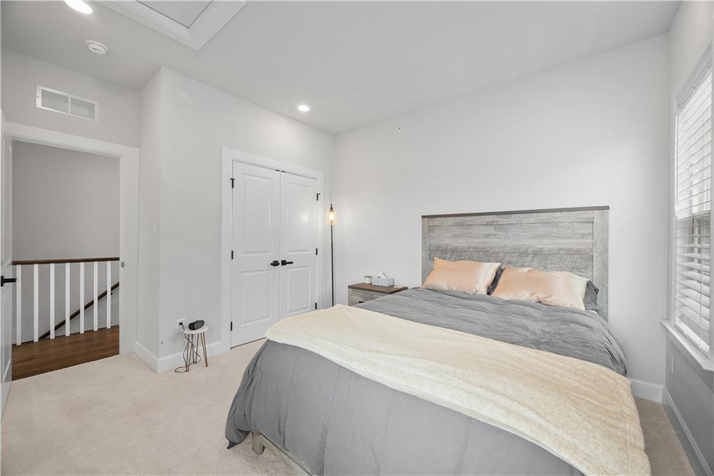 606 Spruce Lane Canonsburg, PA 15317 - Photo 22 of 36 a bedroom with a large bed and a chandelier