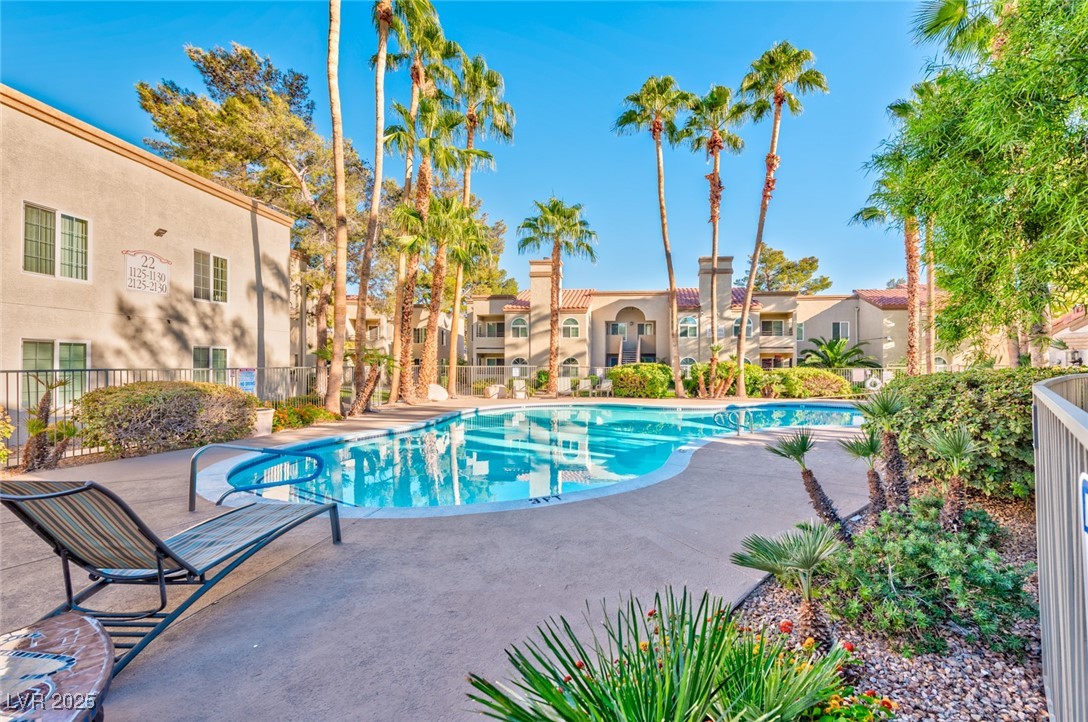 Community pool with a patio area