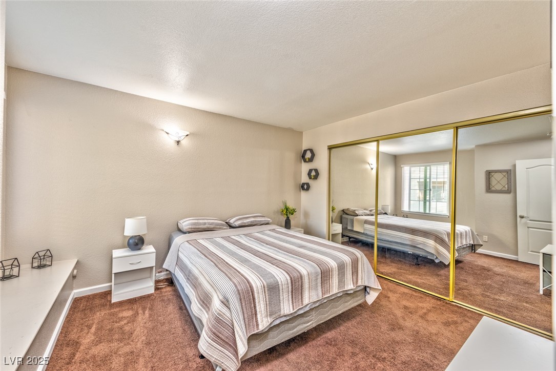 3145 East Flamingo Road, Unit 2068 Las Vegas, NV 89121 - Photo 13 of 15 Bedroom with carpet floors and a closet