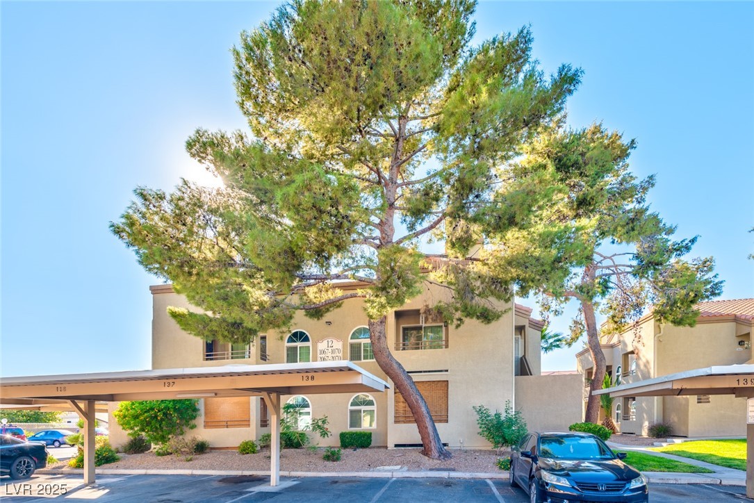 3145 East Flamingo Road, Unit 2068 Las Vegas, NV 89121 - Photo 2 of 15 View of building exterior with covered parking