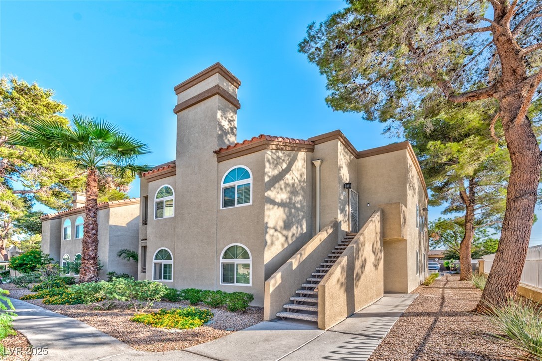 3145 East Flamingo Road, Unit 2068 Las Vegas, NV 89121 - Photo 3 of 15 View of building exterior featuring stairs