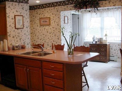 1273 Miller Road Wind Gap, PA 18091 - Photo 8 of 17 a bathroom with a sink and a mirror