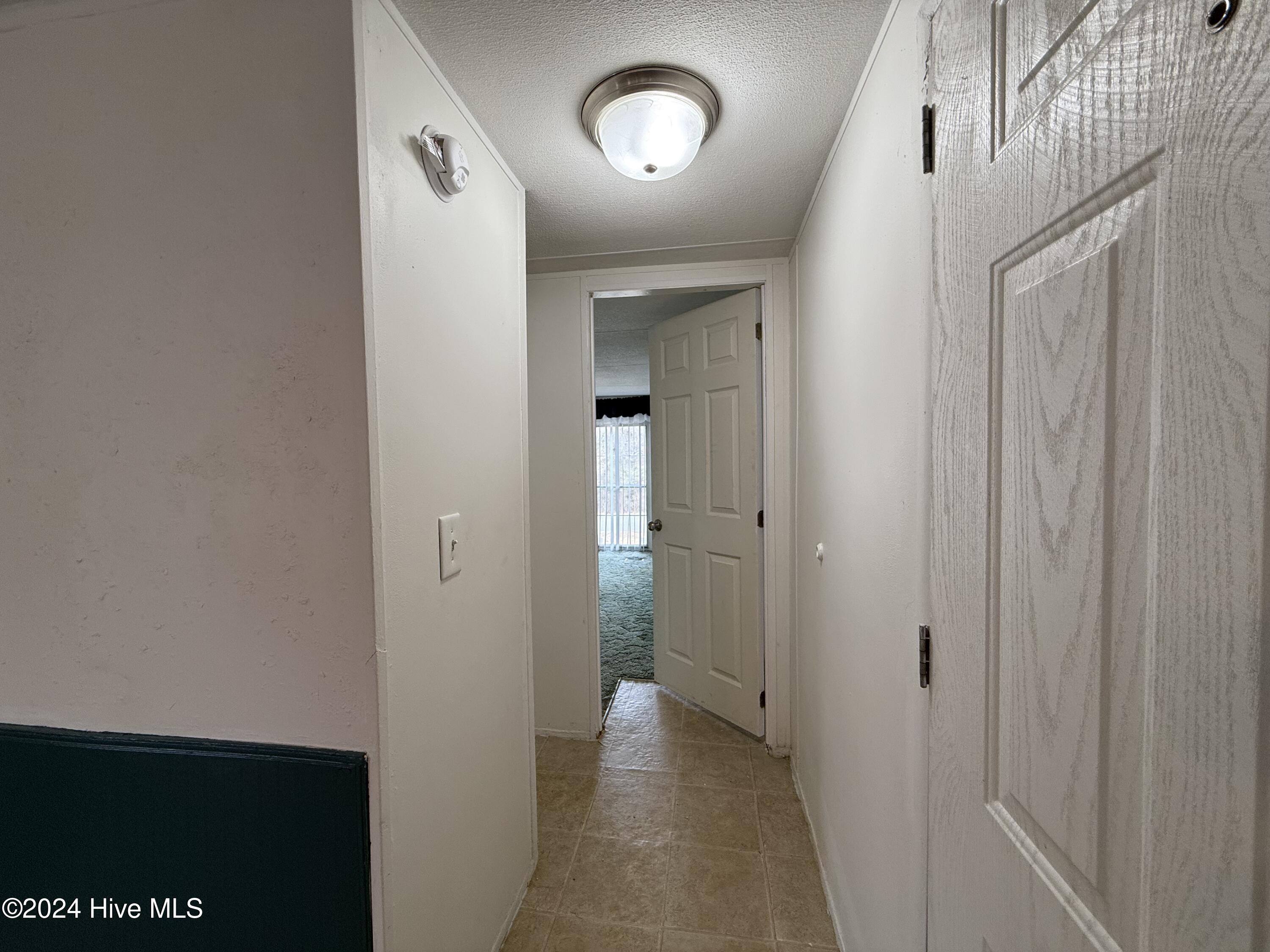 1136-1132 Glancy Road Swansboro, NC 28584 - Photo 68 of 76 1132 Entrance & Spare Bedroom