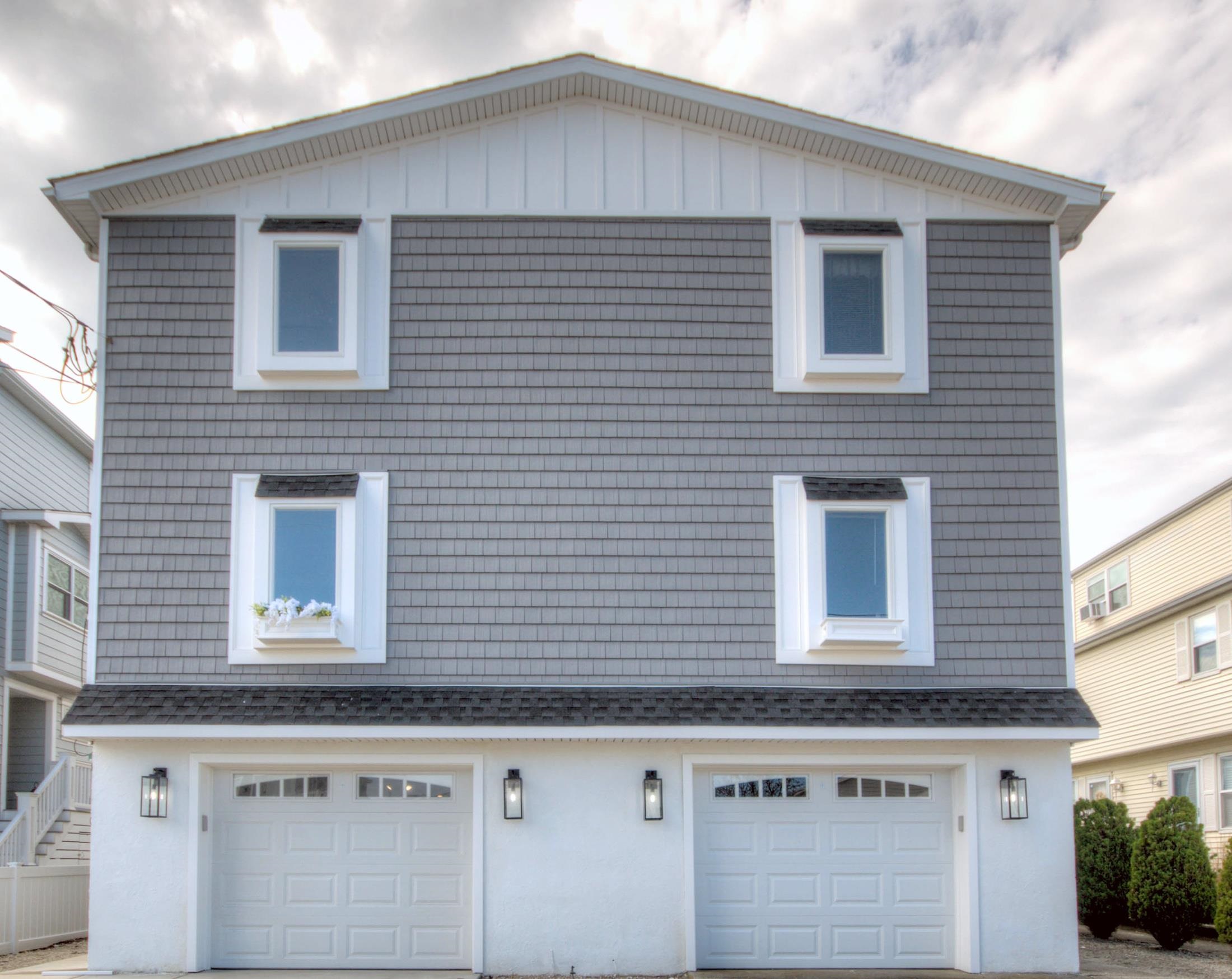 a view of a house with a window and garage