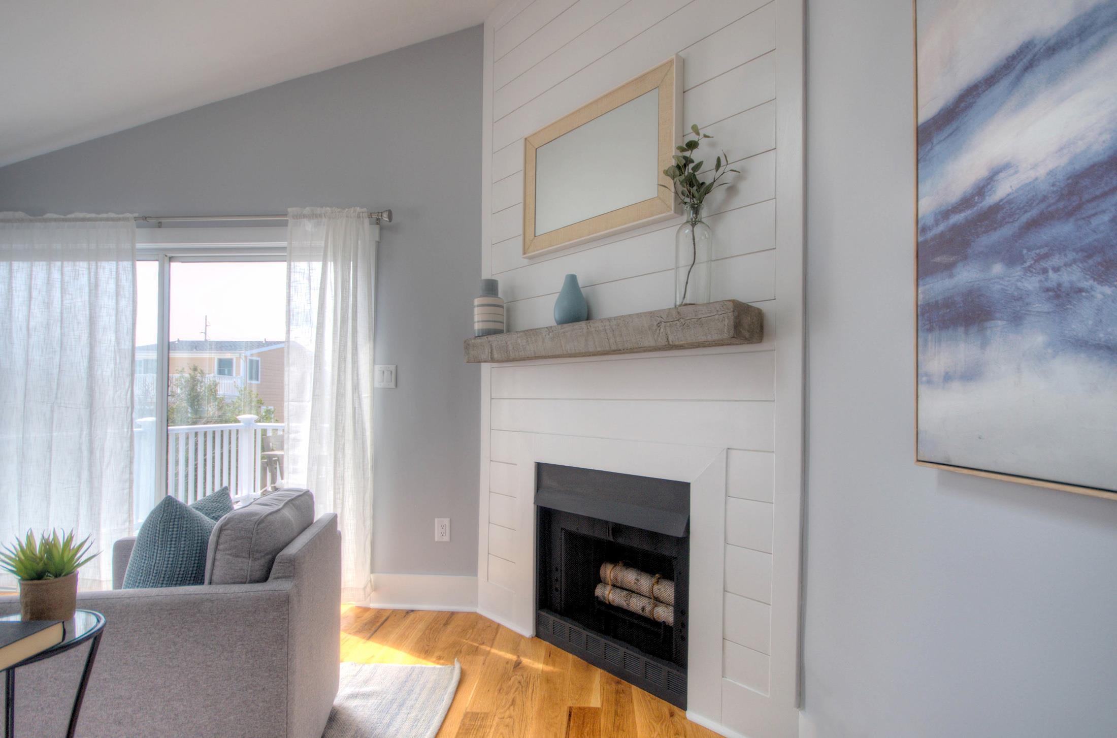 320 40th Street Avalon, NJ 08202 - Photo 11 of 39 a living room with furniture and a fireplace