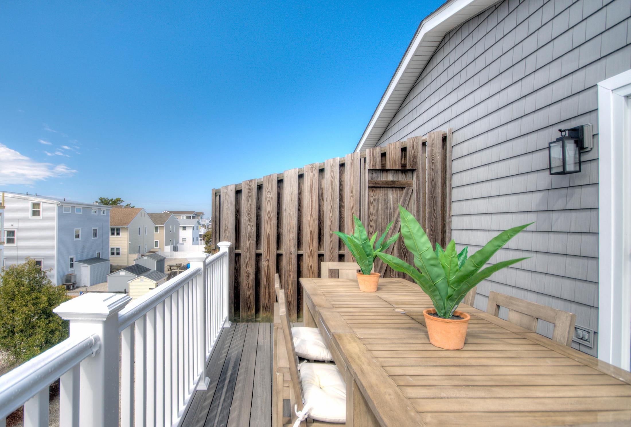 320 40th Street Avalon, NJ 08202 - Photo 12 of 39 a view of a house with porch and wooden floor