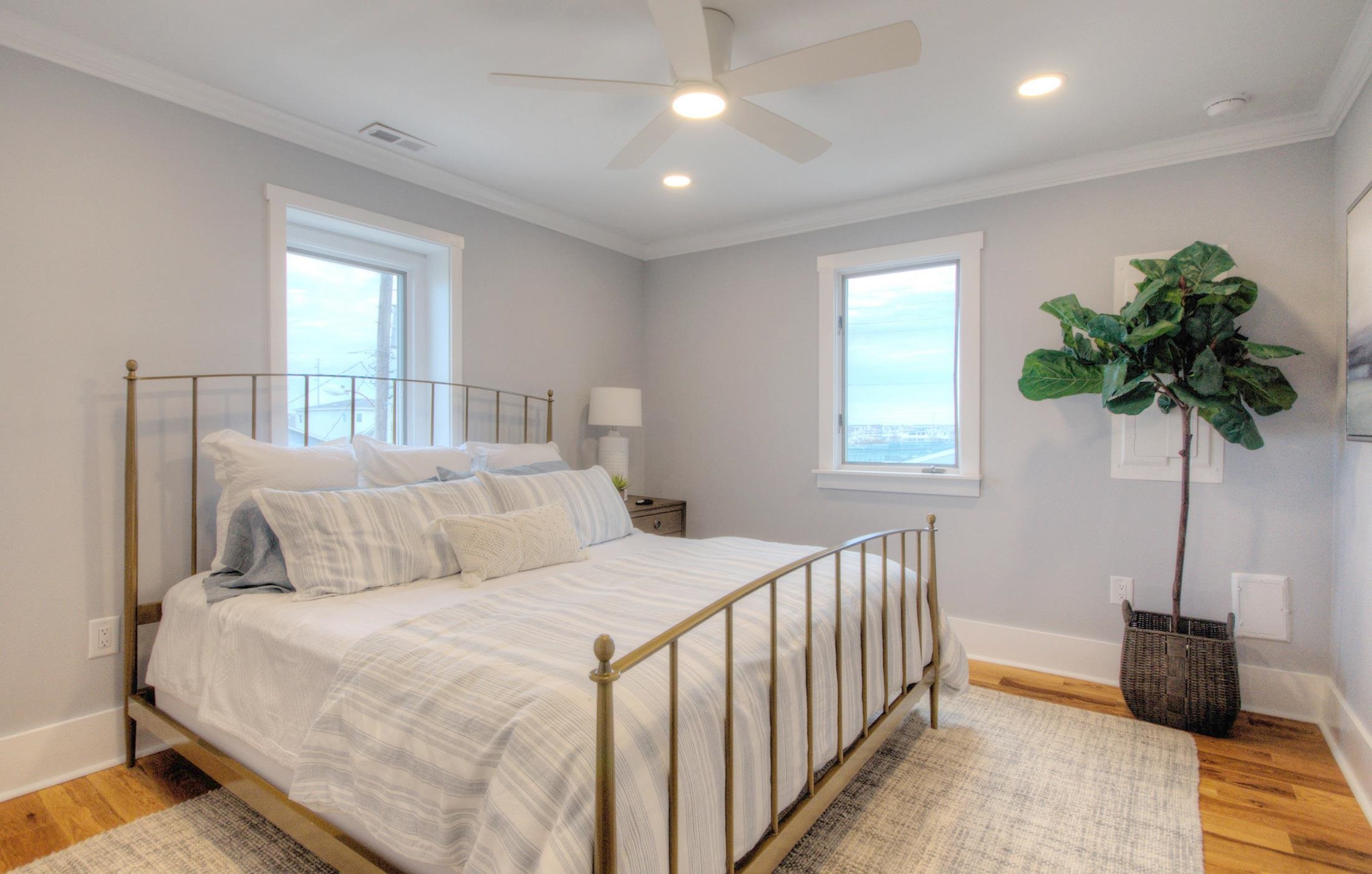 320 40th Street Avalon, NJ 08202 - Photo 20 of 39 a bedroom with a bed and a potted plant