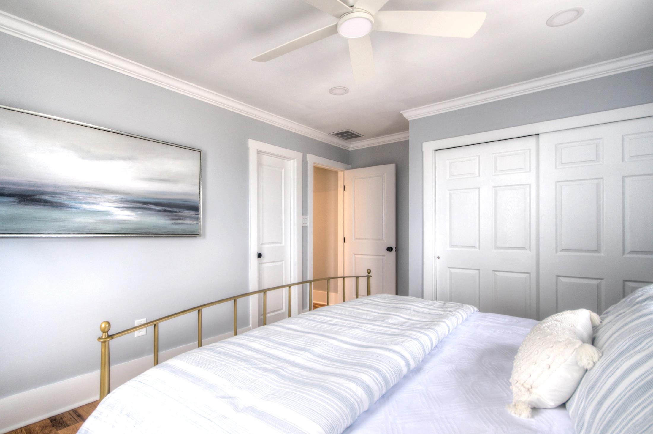 320 40th Street Avalon, NJ 08202 - Photo 22 of 39 a bedroom with a large bed and a chandelier