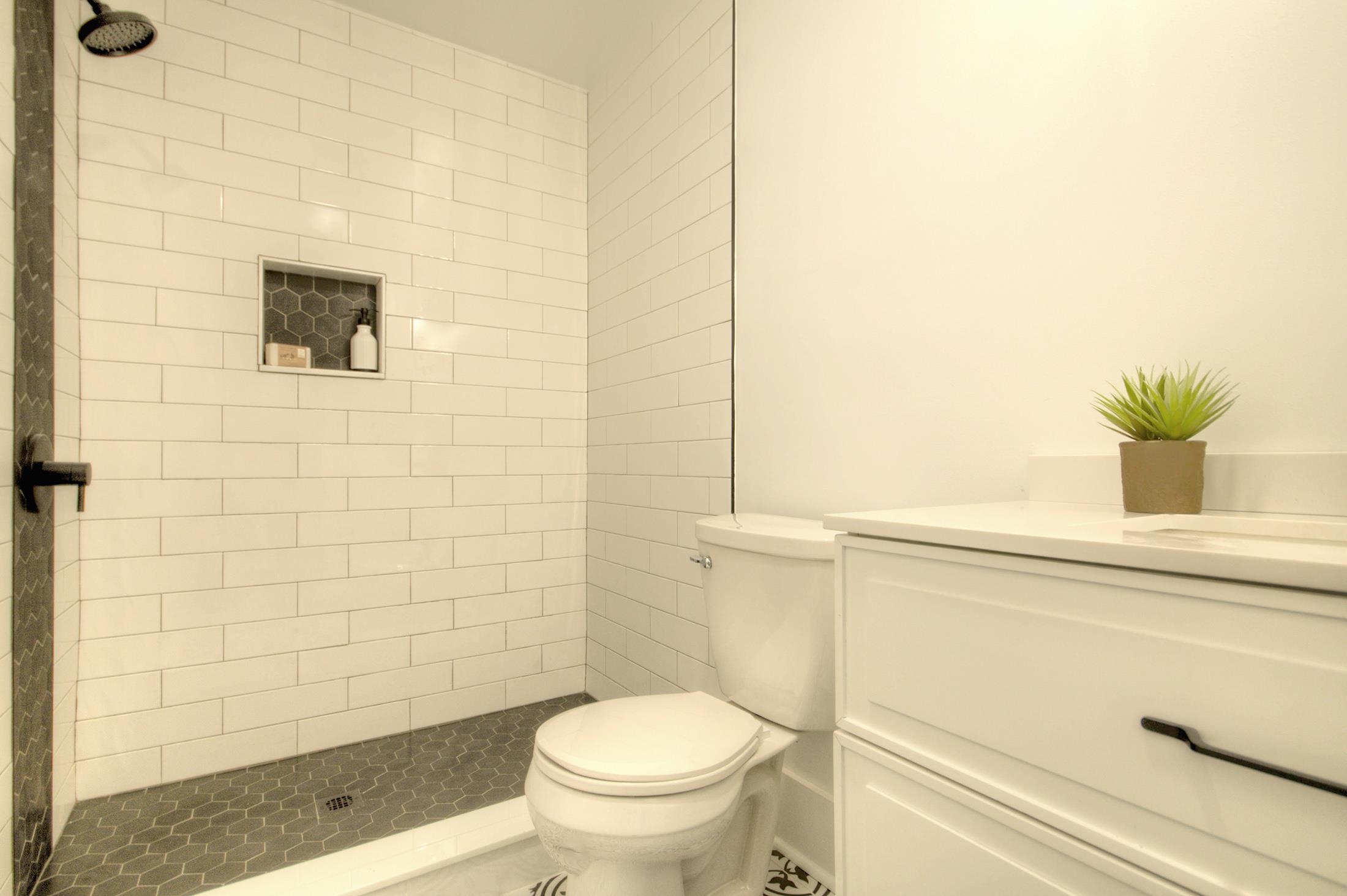 320 40th Street Avalon, NJ 08202 - Photo 27 of 39 a bathroom with a toilet and a shower