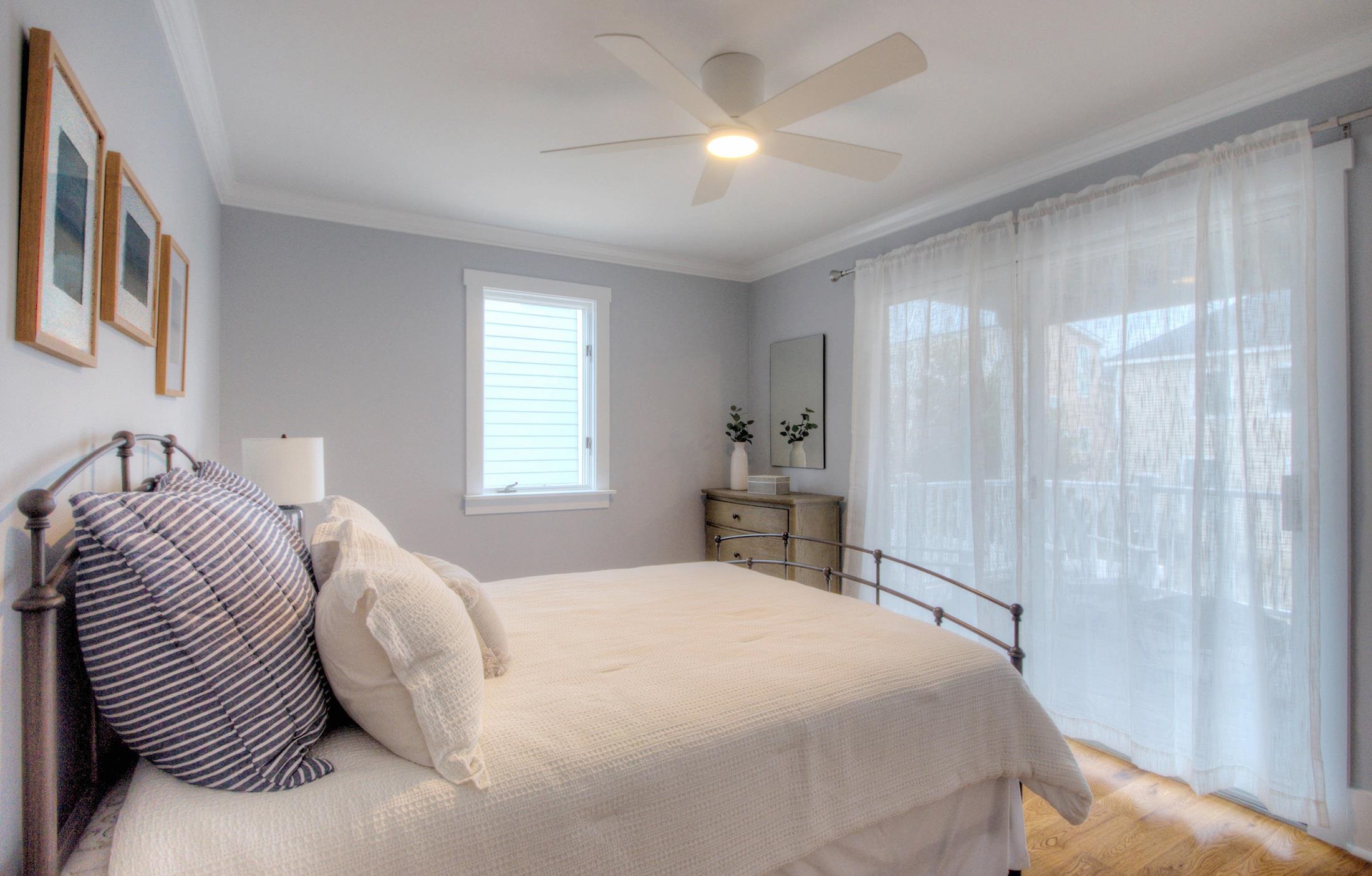 320 40th Street Avalon, NJ 08202 - Photo 28 of 39 a bedroom with a bed and a chandelier