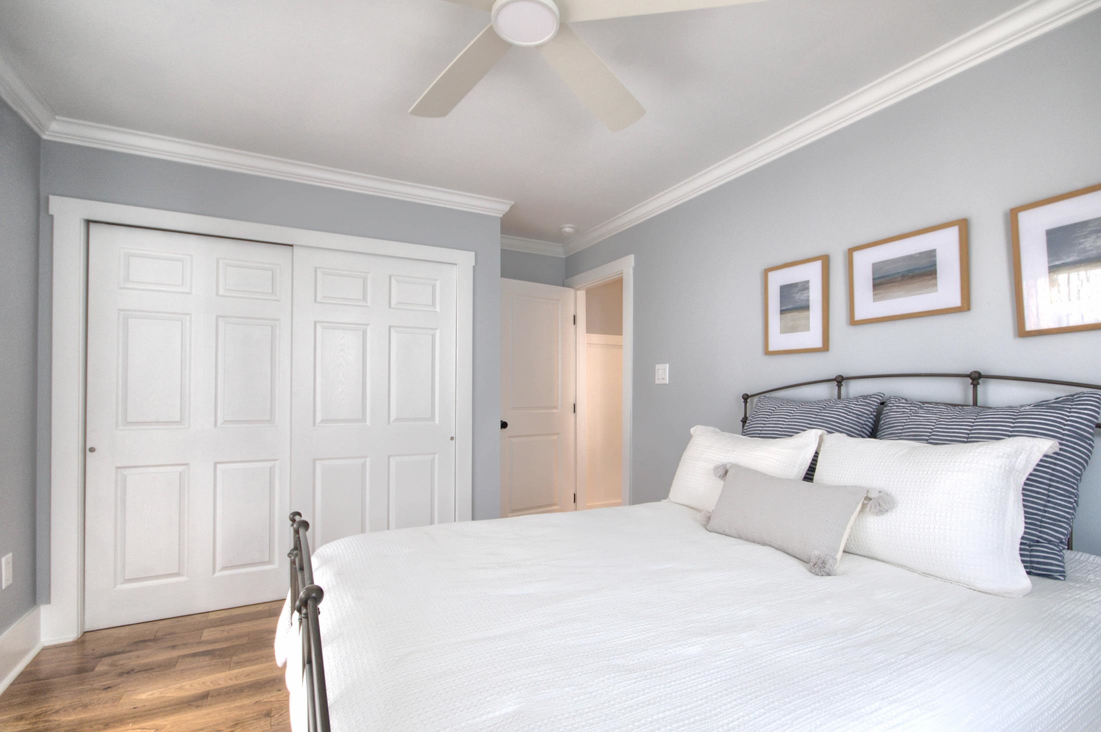 320 40th Street Avalon, NJ 08202 - Photo 29 of 39 a spacious bedroom with a bed and a painting on the wall