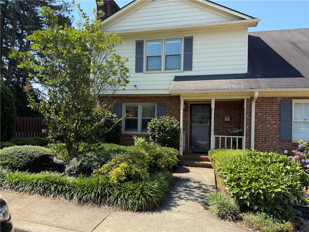 2018 Cardinal Park Drive Anderson, SC 29621 - Photo 1 of 11 A well-maintained facade features a welcoming entry framed by lush, mature landscaping and classic shutters.