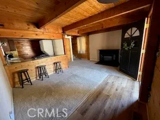 a view of a livingroom with furniture and a fireplace