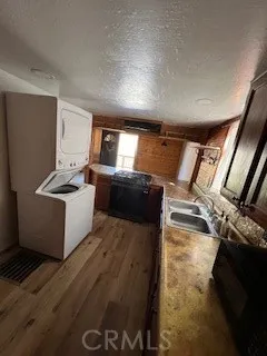 a view of a kitchen with wooden floor