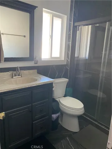 a bathroom with a sink toilet and vanity