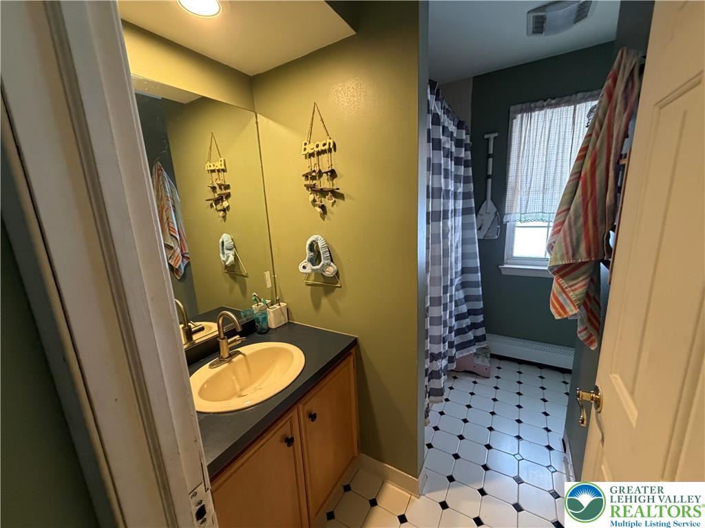 303 East Mountain Top Road Summit Hill, PA 18250 - Photo 26 of 31 a bathroom with a sink a toilet a shower and a mirror