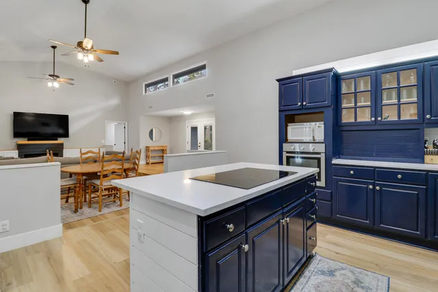 a kitchen with a stove a sink dishwasher and a microwave oven