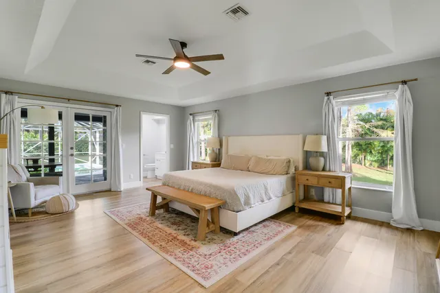 a bedroom with a large bed and a window