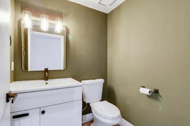 a utility room with cabinets washer and dryer