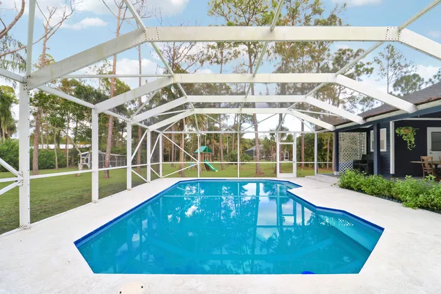 a view of a swimming pool with a patio
