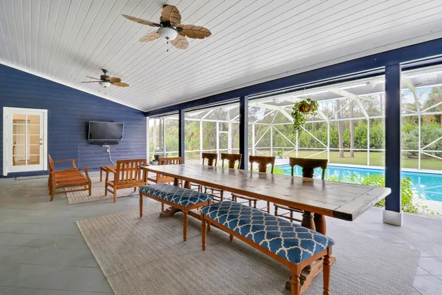a view of a dining table and chairs in the patio