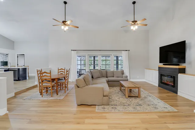 a living room with furniture and a flat screen tv