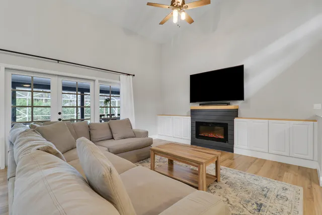 a living room with furniture and a flat screen tv