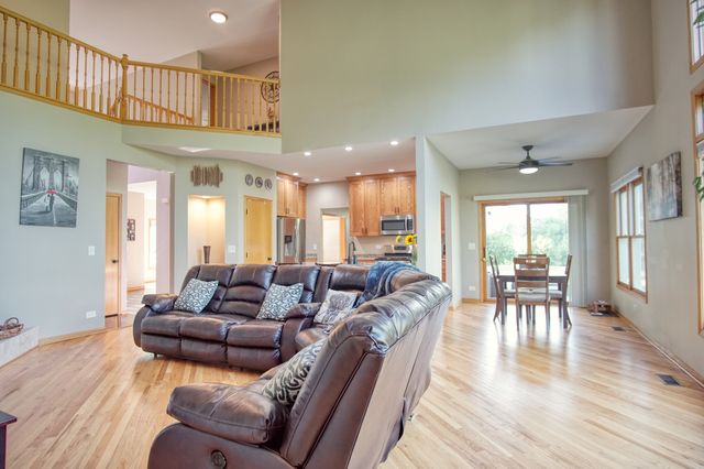 115 North Prospect Avenue Streamwood, IL 60107 - Photo 11 of 41 a living room with furniture wooden floor and a table