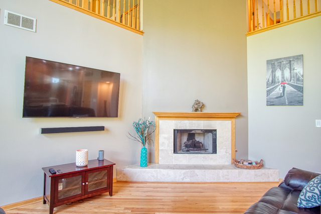 115 North Prospect Avenue Streamwood, IL 60107 - Photo 14 of 41 a living room with furniture and a fireplace