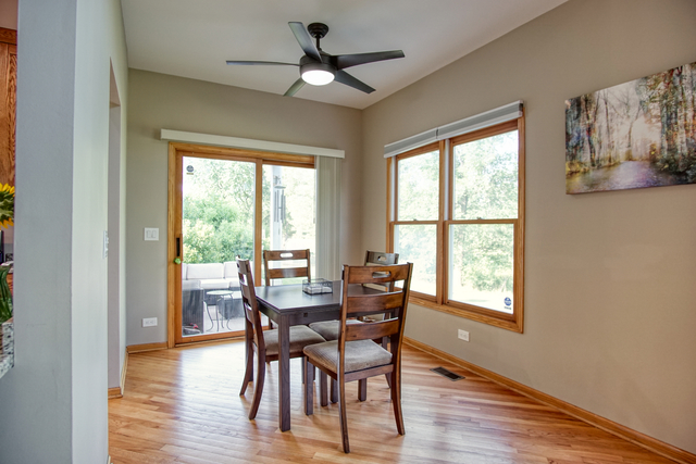 115 North Prospect Avenue Streamwood, IL 60107 - Photo 17 of 41 a view of a dining room with furniture window and wooden floor